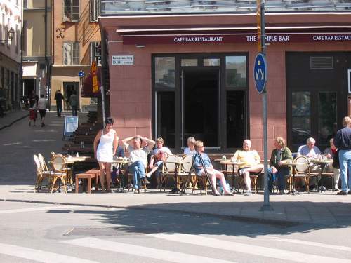 The coffee-houses were full of joyful people, which were delighted with sunny rays. 